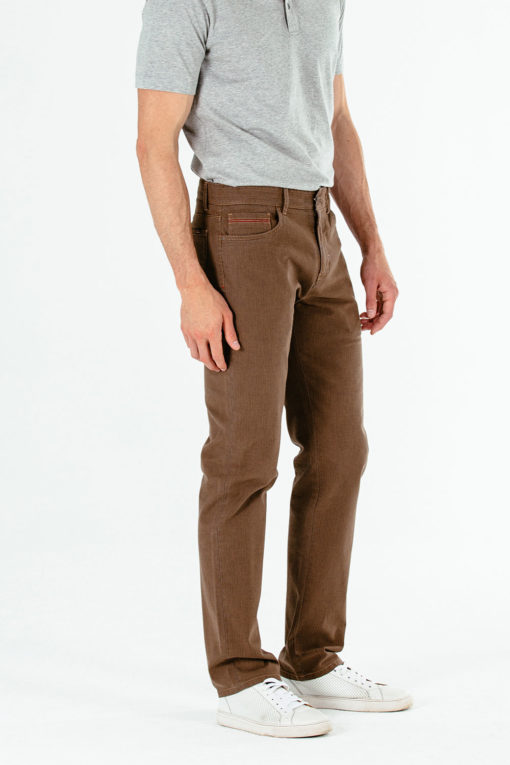 On model Brandon VariagatedHerringbone 5-Pocket Pant color Caribou which is a brown tone.