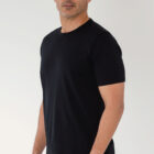 PI3039 liquid cotton pima tee on model side view color black