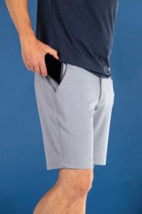 Breakwater Sport Short on model image with a close up on front cell phone pocket